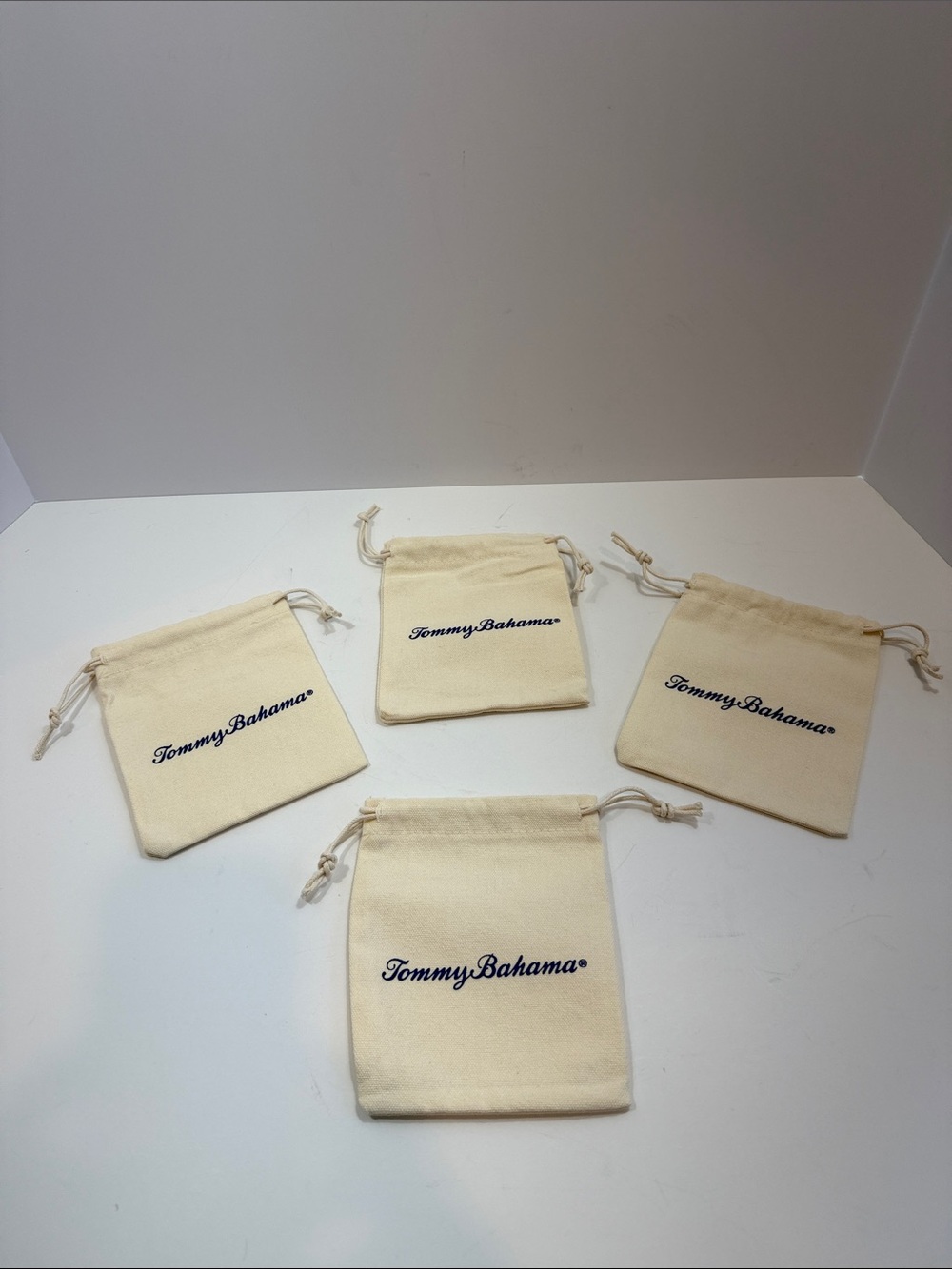 4 Tommy Bahama Cream Canvas Drawstring Jewelry Pouch Trio with Navy Logo